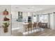 Stylish kitchen featuring an island with seating, stainless appliances, and bright lighting at 5412 E Tierra Buena Ln, Scottsdale, AZ 85254
