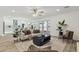 Bright living room featuring modern furnishings, wood floors, and seamless flow to the kitchen at 5412 E Tierra Buena Ln, Scottsdale, AZ 85254