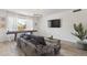 Cozy living room with a large sectional sofa and a view to the outdoors at 5412 E Tierra Buena Ln, Scottsdale, AZ 85254