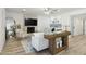 Open-concept living room featuring a fireplace and views into the kitchen at 5412 E Tierra Buena Ln, Scottsdale, AZ 85254