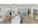 Open-concept living room boasts wood floors, ample seating, and a kitchen view at 5412 E Tierra Buena Ln, Scottsdale, AZ 85254