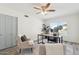 Cozy office features a view of the pool, wood flooring, and a modern ceiling fan at 5412 E Tierra Buena Ln, Scottsdale, AZ 85254