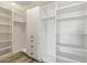 Walk-in closet offering ample storage with built-in shelving and drawers at 5412 E Tierra Buena Ln, Scottsdale, AZ 85254