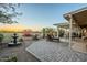 Scenic backyard boasts a desert landscape, stone fountain, and patio area, perfect for relaxation at 5742 S Creosote Dr, Gold Canyon, AZ 85118