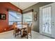 Cozy dining area with an attractive chandelier, a large window, and easy patio access at 5742 S Creosote Dr, Gold Canyon, AZ 85118