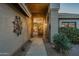 Inviting front entrance with decorative wrought iron accents and desert landscaping at 5742 S Creosote Dr, Gold Canyon, AZ 85118