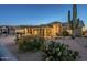 Inviting home exterior featuring desert landscaping with cacti, a two-car garage, and ample curb appeal at 5742 S Creosote Dr, Gold Canyon, AZ 85118