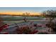 Scenic golf course view with colorful desert flowers during a beautiful sunset in a vibrant outdoor setting at 5742 S Creosote Dr, Gold Canyon, AZ 85118