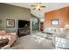 Open living room with neutral tones, a ceiling fan, and comfortable seating at 5742 S Creosote Dr, Gold Canyon, AZ 85118