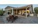 Outdoor patio with pergola, lounge seating, and exterior view of the home at 5742 S Creosote Dr, Gold Canyon, AZ 85118