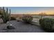 Scenic shot of desert yard space with golf course in distance at 5742 S Creosote Dr, Gold Canyon, AZ 85118