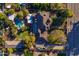 Aerial view of a residential property showcasing a pool, spacious backyard, and convenient driveway access at 616 E Carver Rd, Tempe, AZ 85284