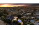 Sunset aerial view of a luxury home showcasing a beautiful pool and lush landscaping in a serene neighborhood at 616 E Carver Rd, Tempe, AZ 85284