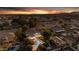 Stunning aerial view of a luxury home featuring a backyard pool and peaceful neighborhood at sunset at 616 E Carver Rd, Tempe, AZ 85284