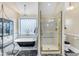 Lavish bathroom with clawfoot tub and a luxurious glass-enclosed shower at 616 E Carver Rd, Tempe, AZ 85284