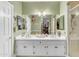 Bathroom featuring double sinks, a large mirror, and plenty of vanity storage at 616 E Carver Rd, Tempe, AZ 85284