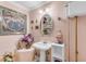 Pink powder room with pedestal sink, unique decor, and stylish fixtures at 616 E Carver Rd, Tempe, AZ 85284