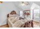 Bedroom with detailed wood bedframe and hardwood floors at 616 E Carver Rd, Tempe, AZ 85284