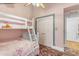 Bedroom with bunkbeds and vintage floral-patterned carpet at 616 E Carver Rd, Tempe, AZ 85284