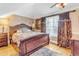 Elegant bedroom featuring a large window, ceiling fan, and a comfortable decorative bed at 616 E Carver Rd, Tempe, AZ 85284