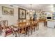 Spacious dining room featuring a large table, ornate chairs, chandelier, and decorative wall art at 616 E Carver Rd, Tempe, AZ 85284