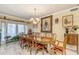 Formal dining room with large table, ornate chairs, chandelier, and decorative accents at 616 E Carver Rd, Tempe, AZ 85284