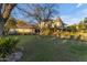 Elegant home with a well-manicured lawn, mature trees, and a charming turret that enhances its curb appeal at 616 E Carver Rd, Tempe, AZ 85284