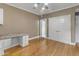 Hardwood floors throughout this home office with custom cabinets and desk, plus double closets for storage at 616 E Carver Rd, Tempe, AZ 85284