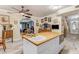 Spacious kitchen with a butcher block island featuring a prep sink and oven at 616 E Carver Rd, Tempe, AZ 85284