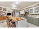 Cozy kitchen featuring a center island with bar stools, sink and modern appliances at 616 E Carver Rd, Tempe, AZ 85284