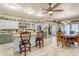 Open concept kitchen with island, counter seating, and elegant decor in an expansive living area at 616 E Carver Rd, Tempe, AZ 85284