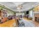 Comfortable living room with hardwood floors, a brick fireplace, and classic decor at 616 E Carver Rd, Tempe, AZ 85284