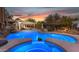 Resort-style pool with a waterfall feature and separate spa, perfect for relaxation at 616 E Carver Rd, Tempe, AZ 85284