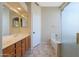 Bathroom with double vanity, tile floors, step-in shower, and separate tub at 6516 W Matilda Ln, Glendale, AZ 85308