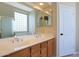 Bright bathroom boasts double sinks, a soaking tub, and a glass block window at 6516 W Matilda Ln, Glendale, AZ 85308