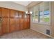 Bright breakfast nook with custom cabinets and window with plantation shutters at 6516 W Matilda Ln, Glendale, AZ 85308