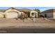 Inviting single-story home featuring desert landscaping and a covered front entry way at 6516 W Matilda Ln, Glendale, AZ 85308