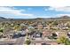 Panoramic aerial view of a residential neighborhood with mountain views and well-maintained streets at 7318 W Paso Trl, Peoria, AZ 85383