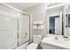 Well-lit bathroom with glass shower door and large mirror provides a serene and functional space at 7318 W Paso Trl, Peoria, AZ 85383