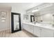 Bright bathroom with double sinks, stylish mirrors, and ample counter space, perfect for modern living at 7318 W Paso Trl, Peoria, AZ 85383