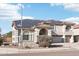 Exterior view of a home with solar panels, desert landscaping, and a spacious three-car garage at 7318 W Paso Trl, Peoria, AZ 85383