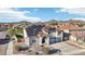 Charming two-story home boasts a desert landscape, tile roof, and solar panels for energy efficiency at 7318 W Paso Trl, Peoria, AZ 85383