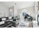 Sunlit living room featuring a grand piano, fireplace, and ample seating at 7318 W Paso Trl, Peoria, AZ 85383