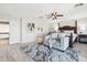 A cozy main bedroom showcasing an elegant bed, soft sitting area, and a serene atmosphere at 7318 W Paso Trl, Peoria, AZ 85383