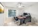 Bright home office space with a large desk and a window offering natural light at 7318 W Paso Trl, Peoria, AZ 85383