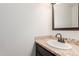 Cozy bathroom featuring a mosaic tile counter, simple sink, and modern mirror at 7539 N 50Th Ave, Glendale, AZ 85301