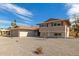 Beautiful home with a front-facing garage, desert rock landscaping and an interesting tree in the front yard at 7539 N 50Th Ave, Glendale, AZ 85301