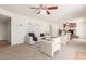 Spacious living room featuring a cozy seating area, brick fireplace, and natural light at 7539 N 50Th Ave, Glendale, AZ 85301