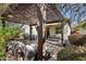 Enjoy this home's backyard with a patio under a pergola, outdoor seating and drought-resistant landscaping at 7924 S 24Th Pl, Phoenix, AZ 85042