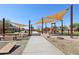 Walking path leads to a community playground, picnic area, and bocce ball court at 7924 S 24Th Pl, Phoenix, AZ 85042